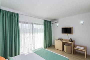 Фото номера Двухместный номер с 1 кроватью Гостевой дом Vila Ryanna Beach г. Эфорие-Норд 24