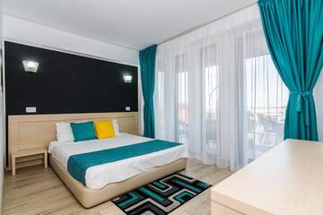Фото номера Двухместный номер с 1 кроватью Гостевой дом Vila Ryanna Beach г. Эфорие-Норд 18